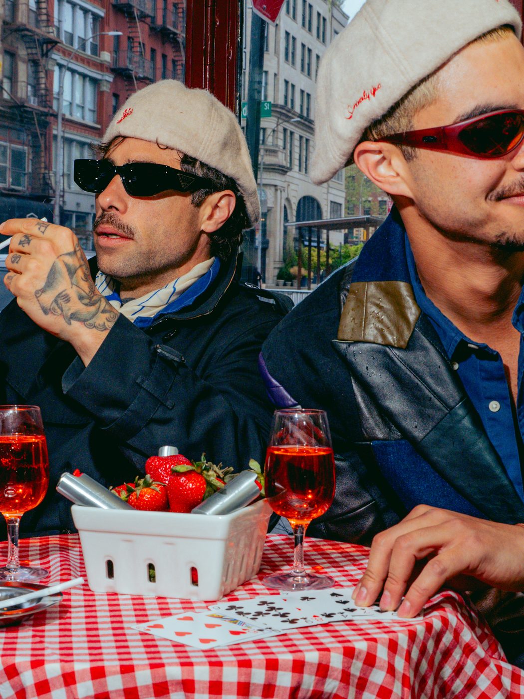 Lighting a cigarette at a café table